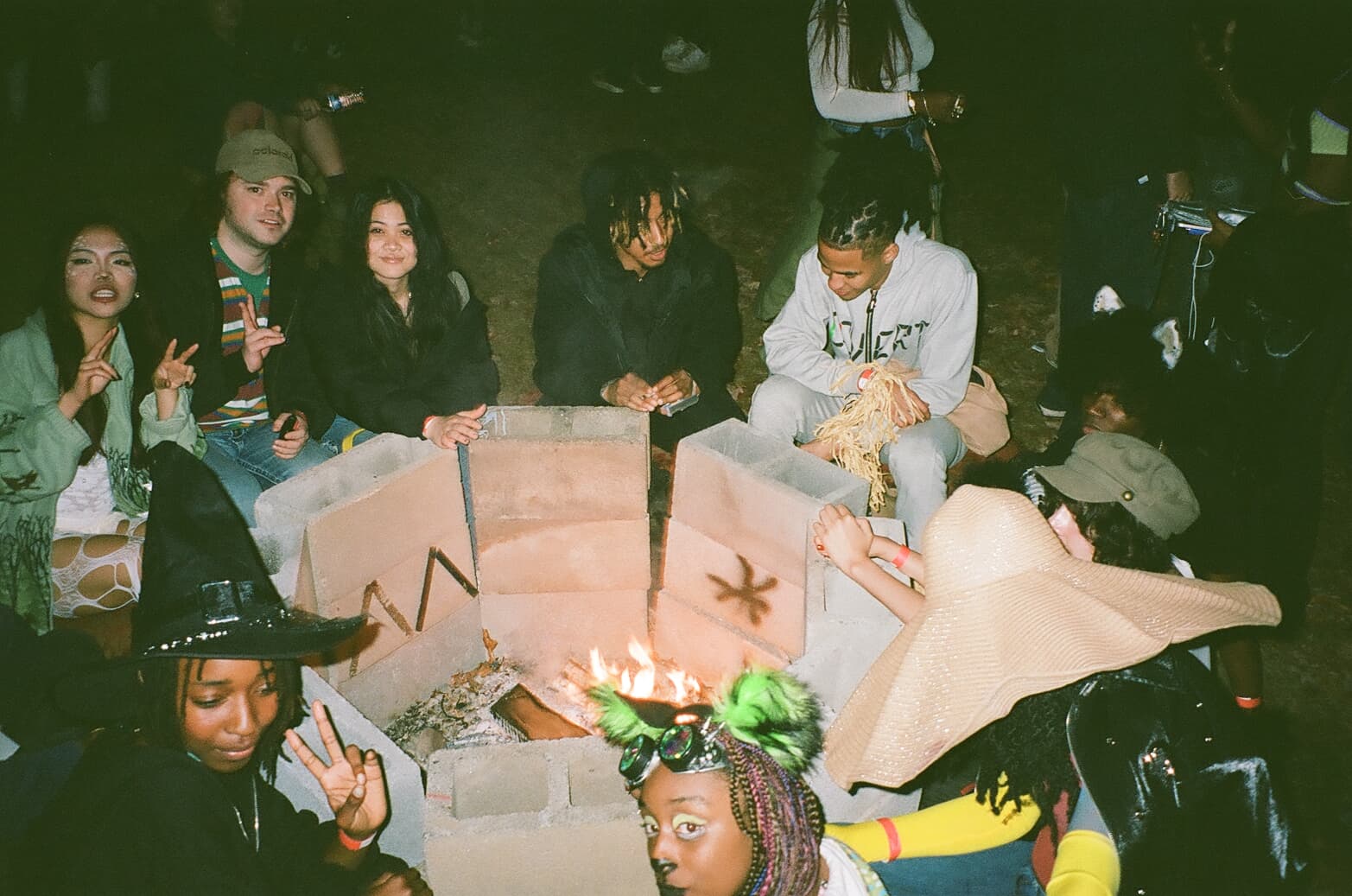 Guests gathered around a fire at Pyrexia.