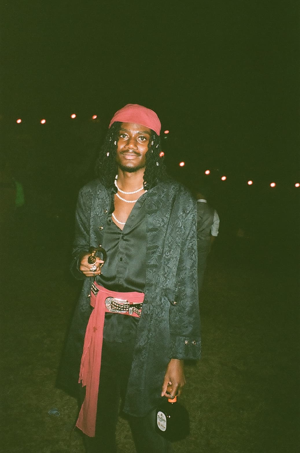 A guest dressed in black and red at Pyrexia.