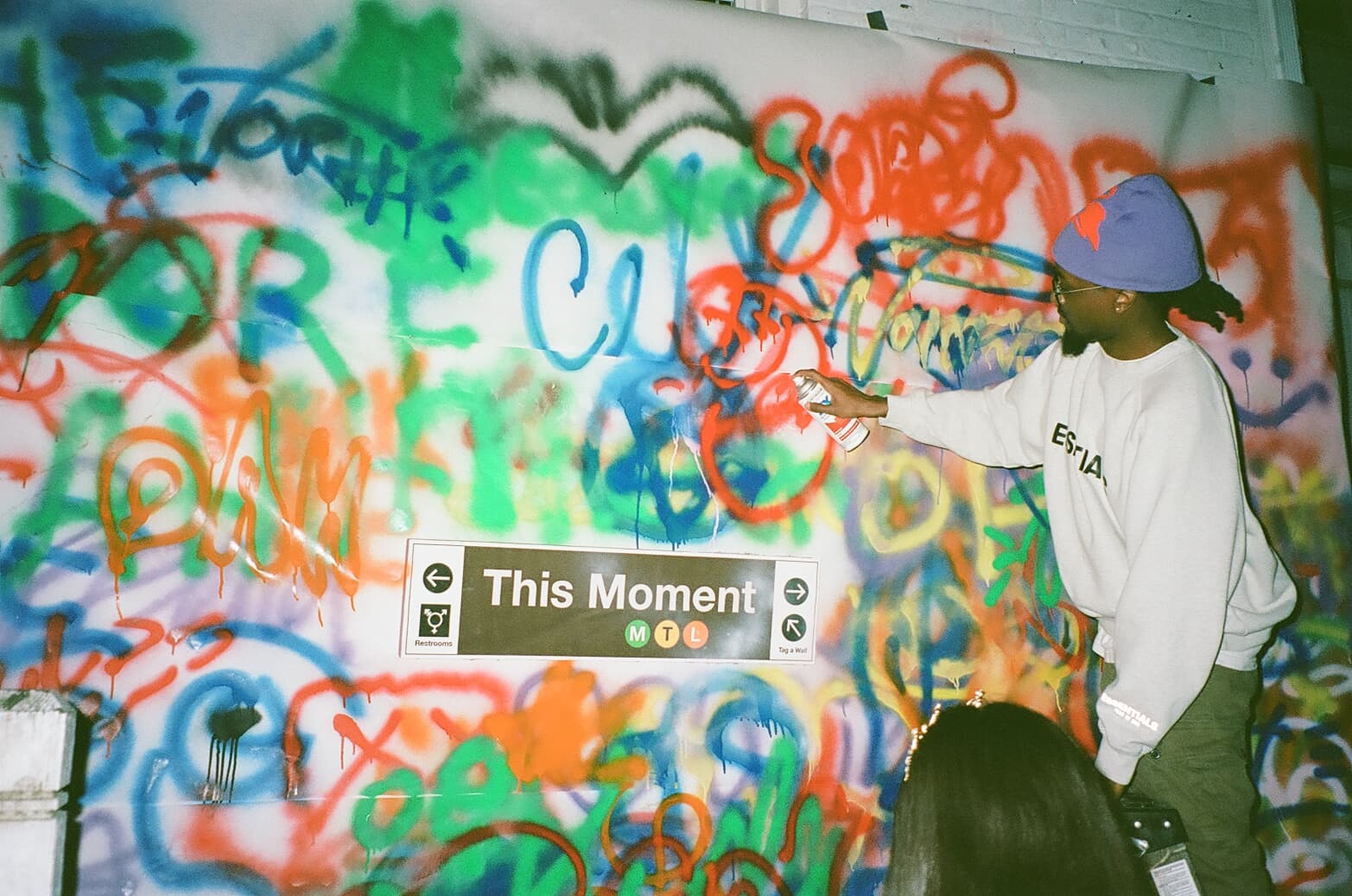 A guest painting Tag-A-Wall during an MTL experience.